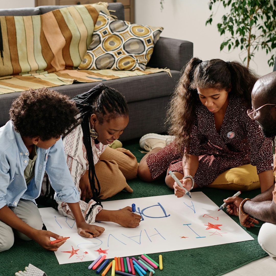 Black family Drawing Placard at Home